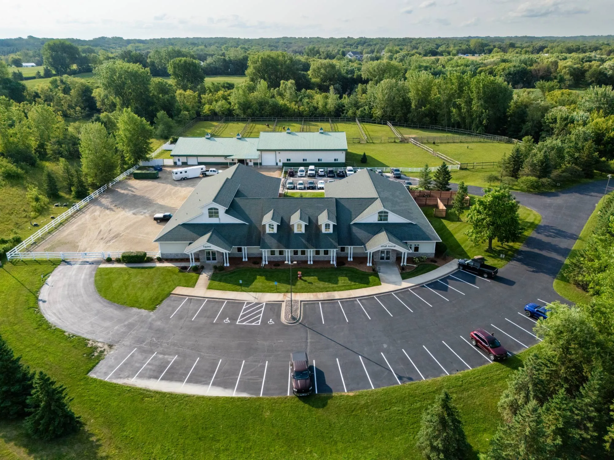Aerial view of Cleary Lake Veterinary Hospital with its equine and small animal entrances, barn and paddocks